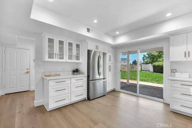 9500 Texhoma Ave, Northridge, CA 91325 - kitchen featuring freestanding refrigerator, light countertops, light wood-style flooring, glass insert cabinets, and recessed lighting