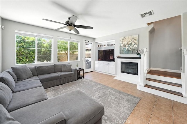 28440 Casselman Ln Unit 361, Saugus, CA 91350 - living room with healthy amount of natural light, tile patterned flooring, ceiling fan, and a glass covered fireplace