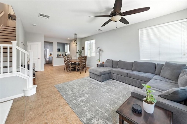 28440 Casselman Ln Unit 361, Saugus, CA 91350 - living room featuring stairs, light tile patterned flooring, and ceiling fan