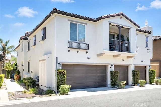 28440 Casselman Ln Unit 361, Saugus, CA 91350 - mediterranean / spanish home with a tiled roof, stucco siding, a garage, and a balcony