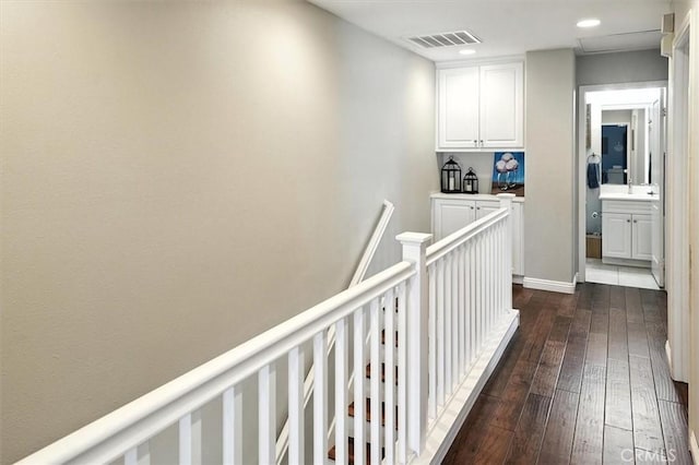 28440 Casselman Ln Unit 361, Saugus, CA 91350 - hallway featuring dark wood-style flooring, an upstairs landing, and recessed lighting