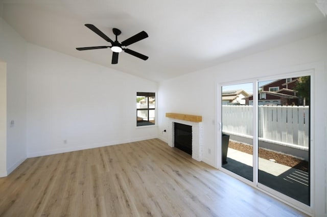 1564 Ashbury Way, Perris, CA 92571 - unfurnished living room featuring lofted ceiling, a fireplace, wood finished floors, and ceiling fan