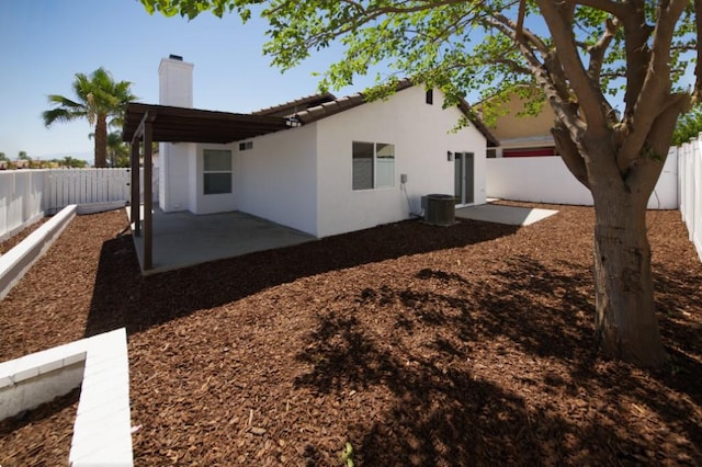 1564 Ashbury Way, Perris, CA 92571 - view of side of home with a patio area, a chimney, stucco siding, and a fenced backyard