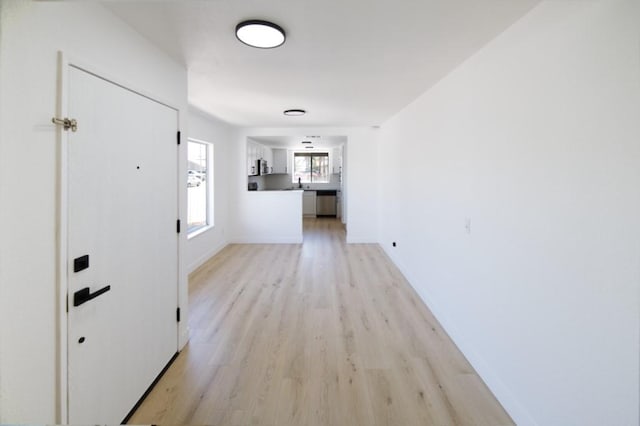 1564 Ashbury Way, Perris, CA 92571 - hall featuring light wood-style flooring and baseboards