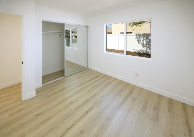 1564 Ashbury Way, Perris, CA 92571 - unfurnished bedroom featuring wood finished floors and a closet