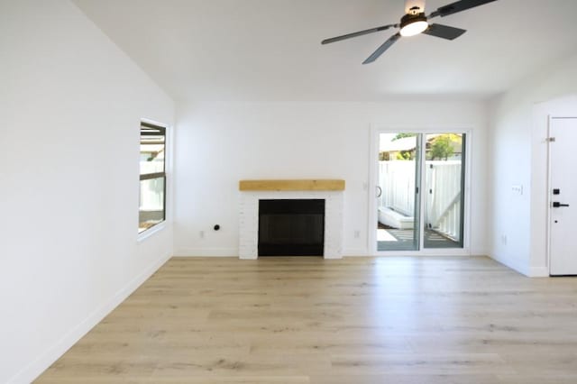 1564 Ashbury Way, Perris, CA 92571 - unfurnished living room featuring light wood-style floors, a fireplace, and ceiling fan