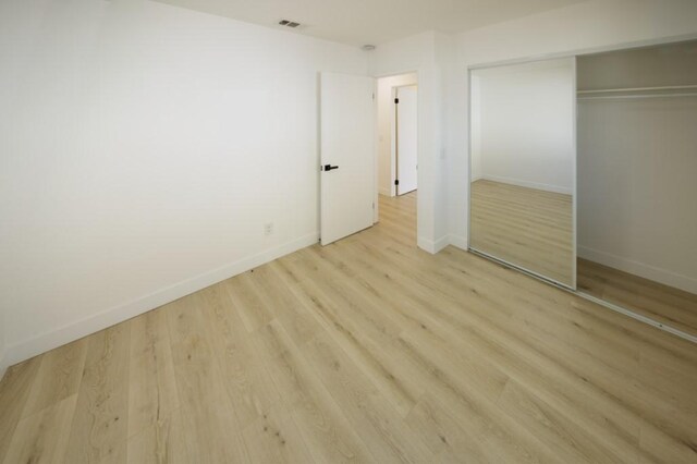 1564 Ashbury Way, Perris, CA 92571 - unfurnished bedroom featuring light wood-type flooring and a closet