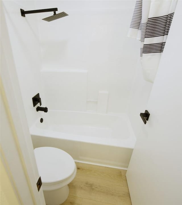 1564 Ashbury Way, Perris, CA 92571 - bathroom with shower / bath combo with shower curtain and wood finished floors