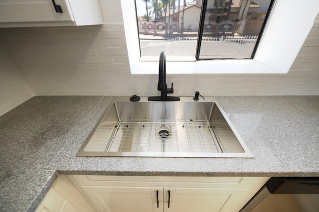 1564 Ashbury Way, Perris, CA 92571 - kitchen view of decorative backsplash, white cabinetry, and light stone countertops