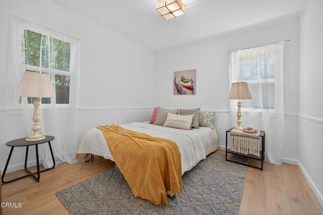 901 Drown Ave, Ojai, CA 93023 - bedroom featuring multiple windows, wood finished floors, and crown molding