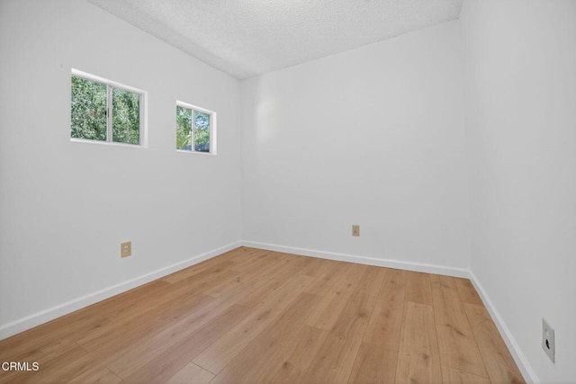 901 Drown Ave, Ojai, CA 93023 - empty room with light wood finished floors and a textured ceiling