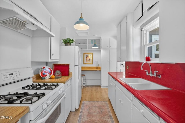 901 Drown Ave, Ojai, CA 93023 - kitchen featuring gas range gas stove, custom range hood, white cabinets, light wood-style flooring, and decorative light fixtures