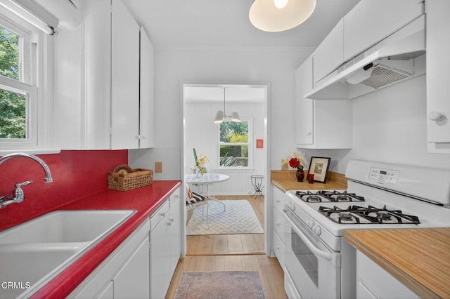 901 Drown Ave, Ojai, CA 93023 - kitchen featuring white appliances, light wood-type flooring, white cabinets, and healthy amount of natural light