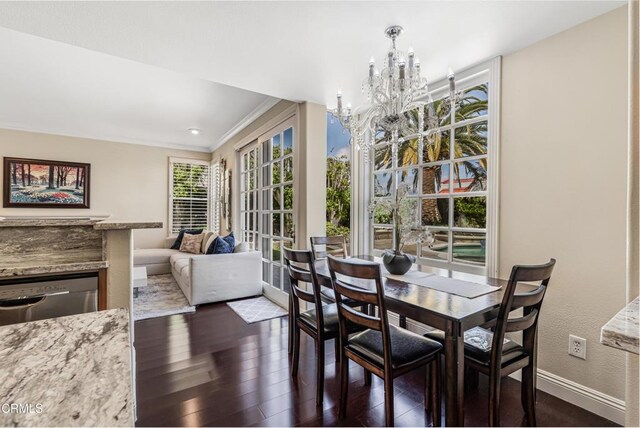 1449 La Culebra Cir, Camarillo, CA 93012 - dining room with a chandelier, dark wood-style flooring, crown molding, and a textured wall