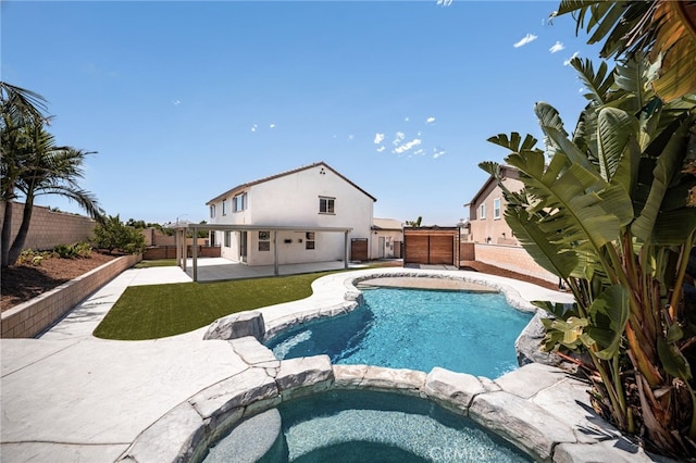 11810 Sanderling Way, Jurupa Valley, CA 91752 - view of pool with a patio, a fenced backyard, and a pool with connected hot tub