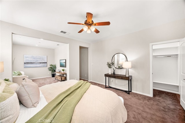 11810 Sanderling Way, Jurupa Valley, CA 91752 - carpeted bedroom featuring a walk in closet and ceiling fan