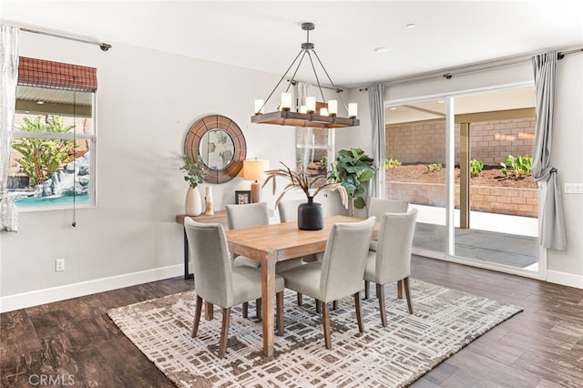 11810 Sanderling Way, Jurupa Valley, CA 91752 - dining area with healthy amount of natural light, dark wood-type flooring, and a chandelier