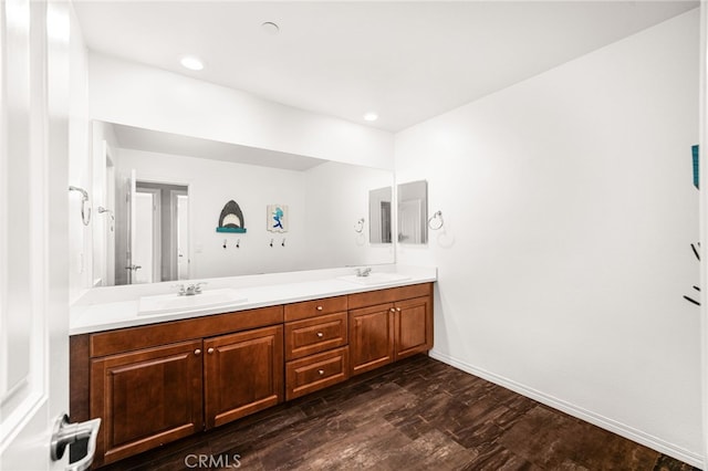 11810 Sanderling Way, Jurupa Valley, CA 91752 - bathroom featuring double vanity, wood finished floors, and recessed lighting