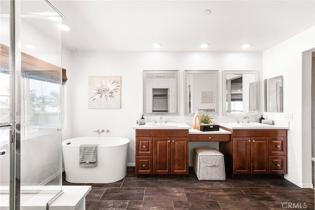 11810 Sanderling Way, Jurupa Valley, CA 91752 - full bath featuring double vanity, a freestanding tub, plenty of natural light, and recessed lighting
