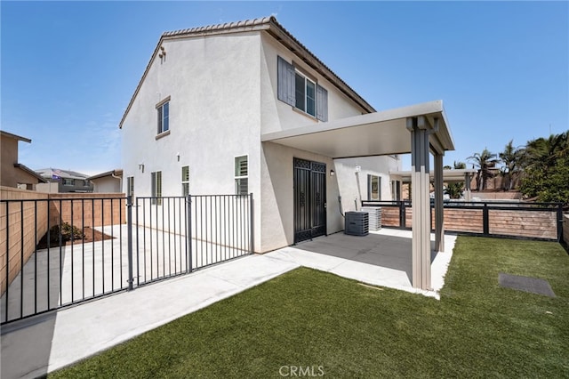 11810 Sanderling Way, Jurupa Valley, CA 91752 - rear view of house with a patio area, a fenced backyard, and stucco siding