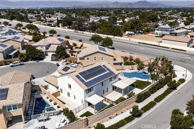 11810 Sanderling Way, Jurupa Valley, CA 91752 - aerial perspective of suburban area with a pool area and a mountain backdrop