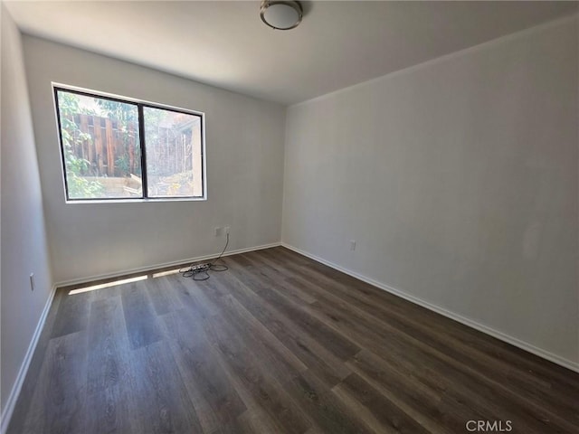 38318 Miramonte Ave, Palmdale, CA 93551 - unfurnished room with dark wood-type flooring and baseboards