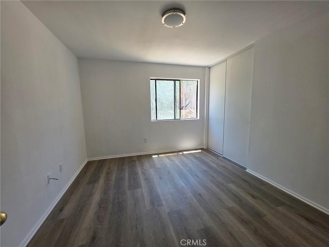 38318 Miramonte Ave, Palmdale, CA 93551 - empty room featuring dark wood-style floors and baseboards