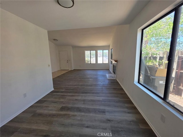38318 Miramonte Ave, Palmdale, CA 93551 - unfurnished living room featuring dark wood finished floors and baseboards