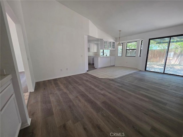 38318 Miramonte Ave, Palmdale, CA 93551 - unfurnished living room with wood finished floors and high vaulted ceiling