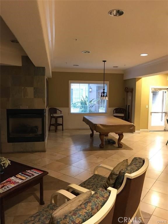 2750 Artesia Blvd Unit 341, Redondo Beach, CA 90278 - game room with crown molding, pool table, a tile fireplace, and light tile patterned floors