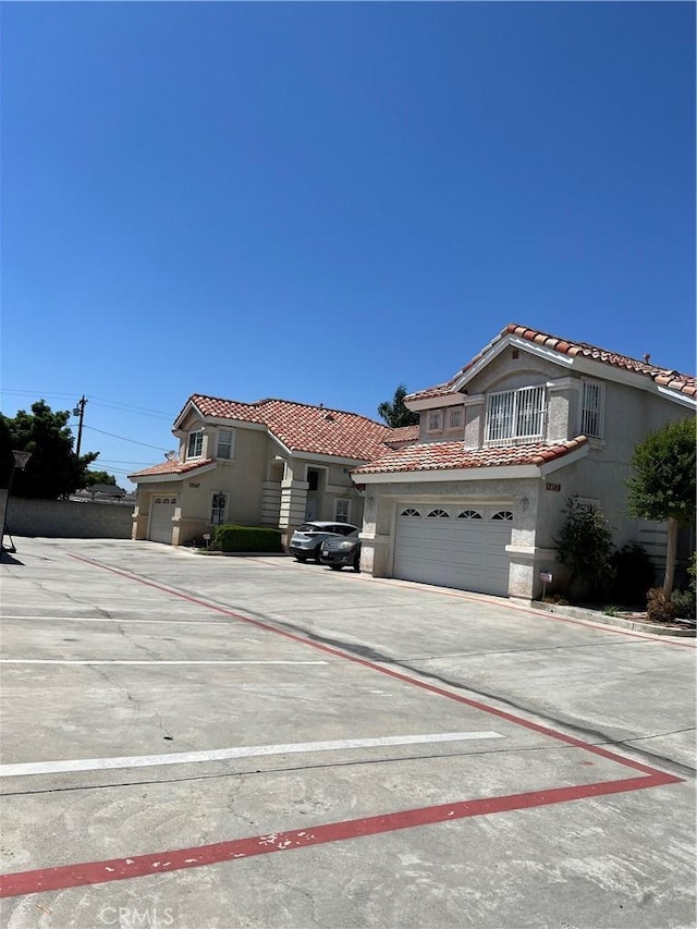 12143 Ferris Rd, El Monte, CA 91732 - view of front of house with a tiled roof and stucco siding