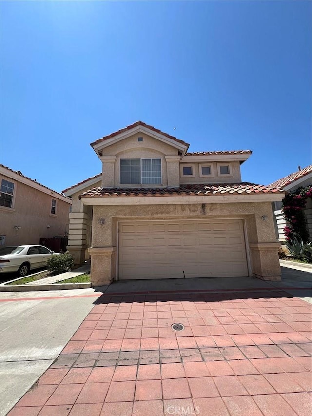 12143 Ferris Rd, El Monte, CA 91732 - multi unit property with stucco siding, a tiled roof, and a garage