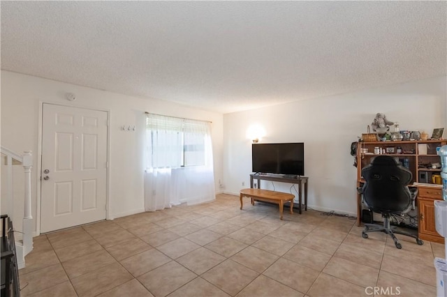 123 Olive St, Paso Robles, CA 93446 - living room featuring a textured ceiling, light tile patterned floors, and an office area