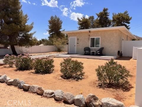 55687 Onaga Trl, Yucca Valley, CA 92284 - back of house featuring stucco siding