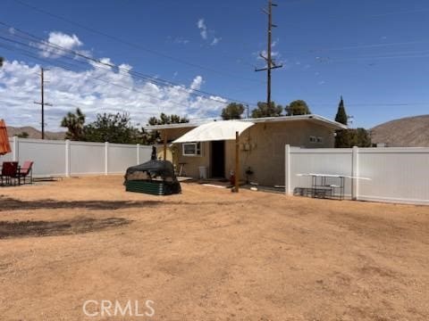 55687 Onaga Trl, Yucca Valley, CA 92284 - back of property featuring a fenced backyard