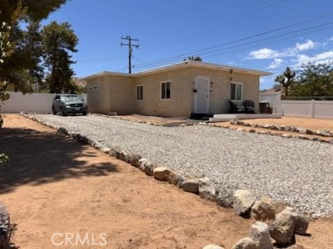 55687 Onaga Trl, Yucca Valley, CA 92284 - back of property featuring stucco siding