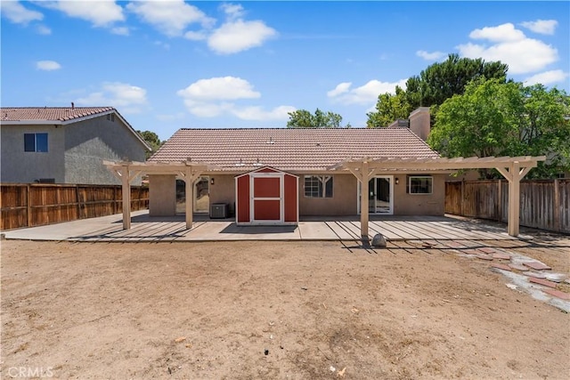 37537 Sabal Ct, Palmdale, CA 93552 - back of house with a pergola, a storage unit, a patio area, and a fenced backyard