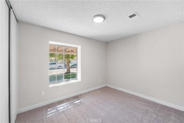 37537 Sabal Ct, Palmdale, CA 93552 - carpeted empty room with a textured ceiling and baseboards