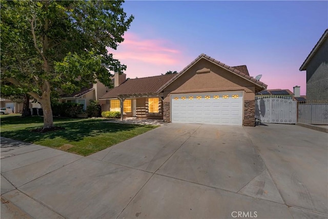 37537 Sabal Ct, Palmdale, CA 93552 - ranch-style house featuring a tiled roof, an attached garage, driveway, and stone siding
