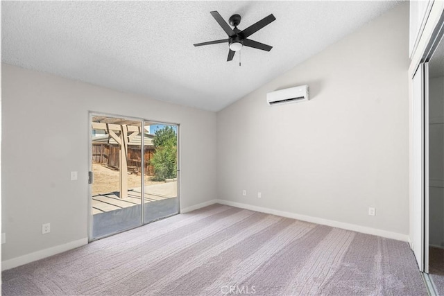 37537 Sabal Ct, Palmdale, CA 93552 - unfurnished bedroom featuring a wall unit AC, access to outside, carpet flooring, a textured ceiling, and vaulted ceiling
