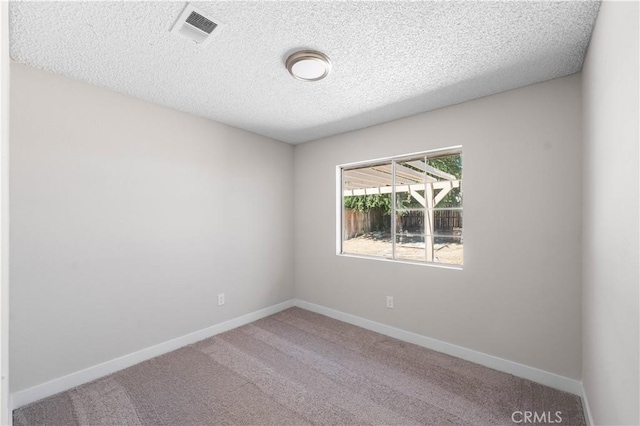 37537 Sabal Ct, Palmdale, CA 93552 - spare room featuring a textured ceiling and carpet floors