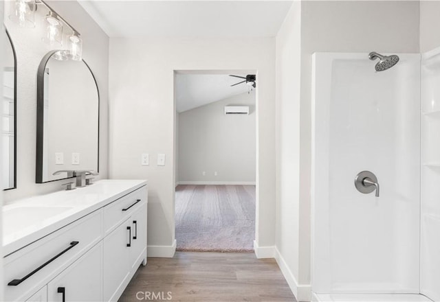37537 Sabal Ct, Palmdale, CA 93552 - full bath featuring a shower, wood finished floors, double vanity, ceiling fan, and an AC wall unit