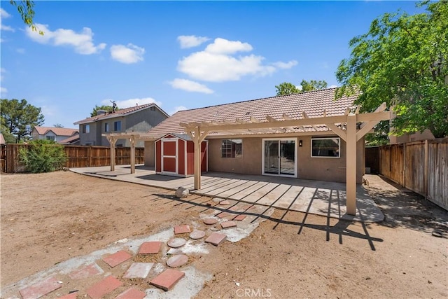 37537 Sabal Ct, Palmdale, CA 93552 - back of house with a pergola, a shed, and a tiled roof