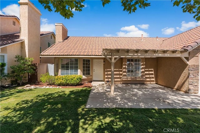 37537 Sabal Ct, Palmdale, CA 93552 - back of property with a tile roof, stucco siding, a patio area, and a pergola