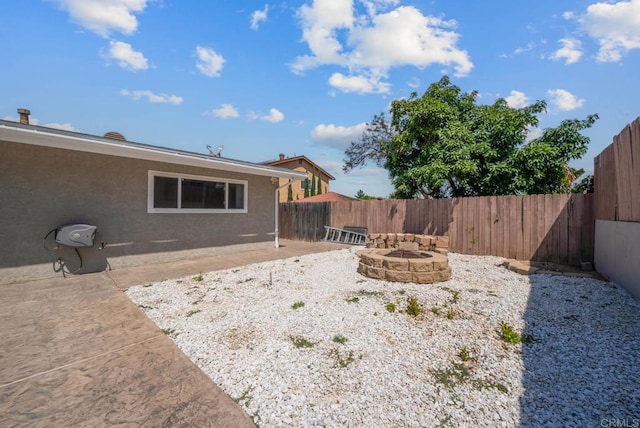 1203 Fifth Ave, Chula Vista, CA 91911 - fenced backyard with an outdoor fire pit and a patio area