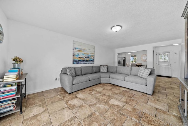1203 Fifth Ave, Chula Vista, CA 91911 - living area with light stone finish floors and a textured ceiling