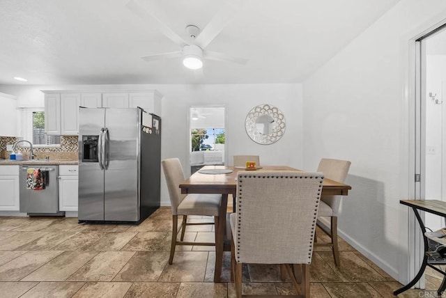 1203 Fifth Ave, Chula Vista, CA 91911 - dining room featuring ceiling fan and stone tile floors