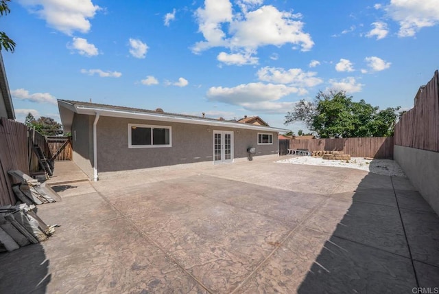 1203 Fifth Ave, Chula Vista, CA 91911 - rear view of house featuring stucco siding, a patio area, french doors, and a fenced backyard