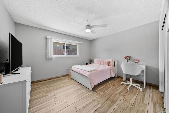 1203 Fifth Ave, Chula Vista, CA 91911 - bedroom with wood tiled floors, a textured ceiling, and a ceiling fan