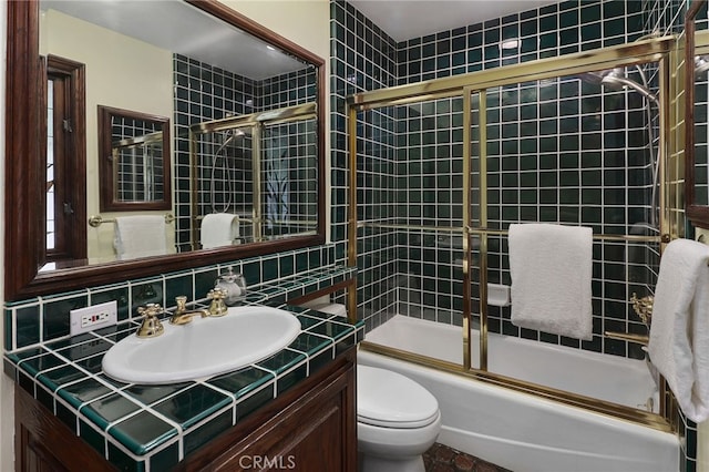 6137 Paseo La Vis, Woodland Hills, CA 91367 - bathroom with vanity, tasteful backsplash, bath / shower combo with glass door, and tile walls